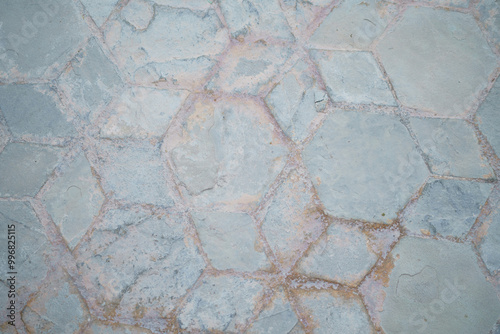 Gray floor tiles in free arrangement