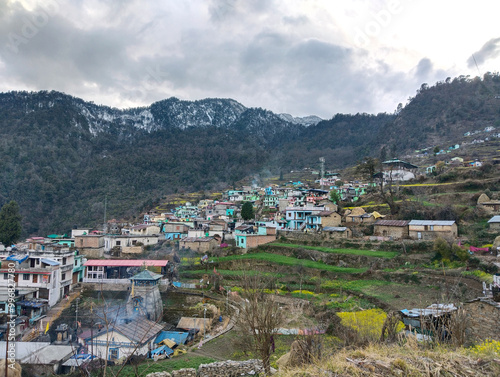 Panoramic landscape of great Himalayas mountain range during an autumn morning from Kausani also known as 'Switzerland of India' a hill station in Bageshwar district, Uttarakhand, India. photo
