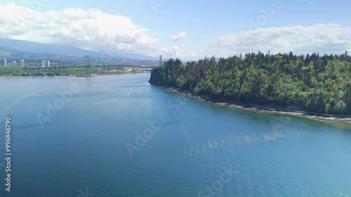Aerial view of Stanley Park in Vancouver shore with the city and sea