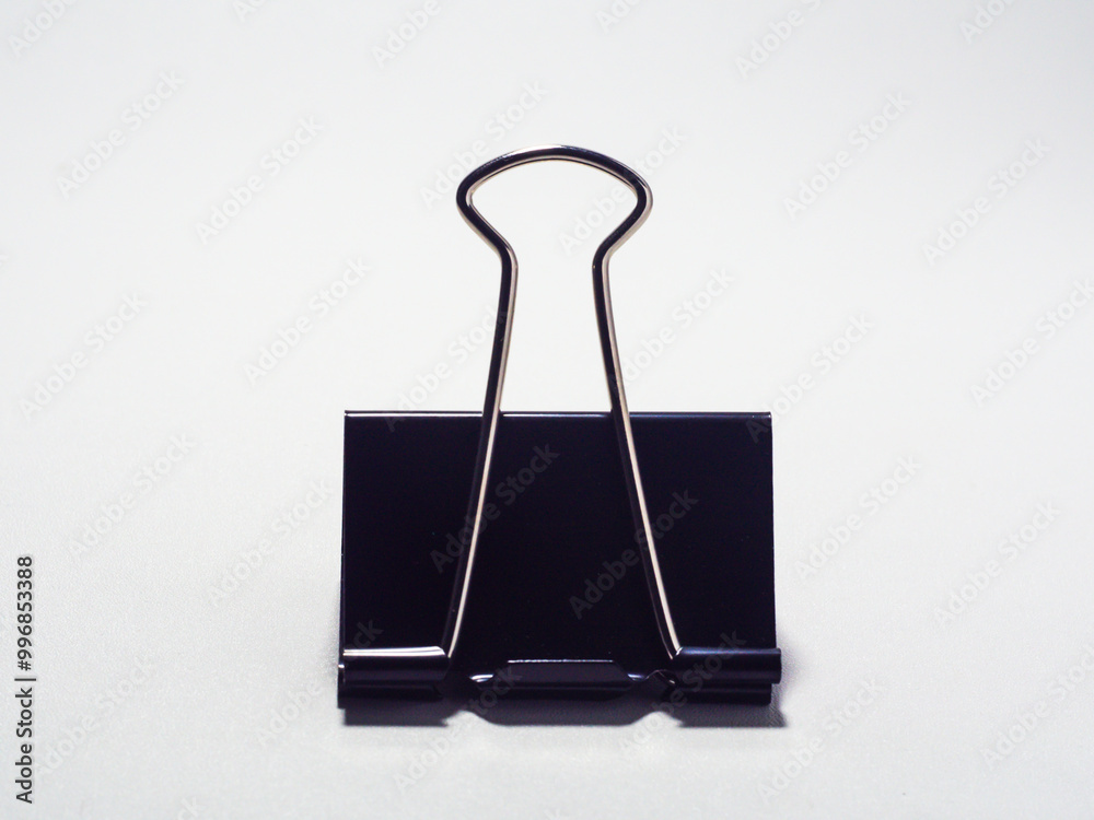 Black metal paperclip on a white background Black metal paperclip on a white background