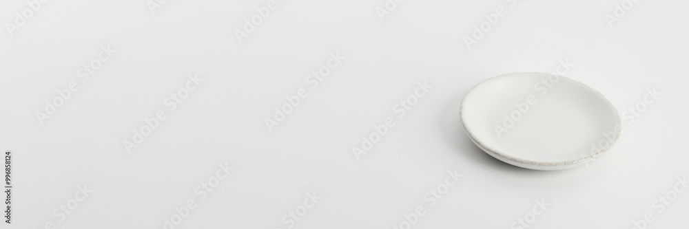 A minimalistic white plate on a clean surface, perfect for food photography, restaurant menus, or culinary presentations. A minimalistic white plate on a clean surface, perfect for food photography, restaurant menus, or culinary presentations.