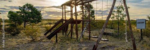 Rustic wooden playground for children in steppen landscape