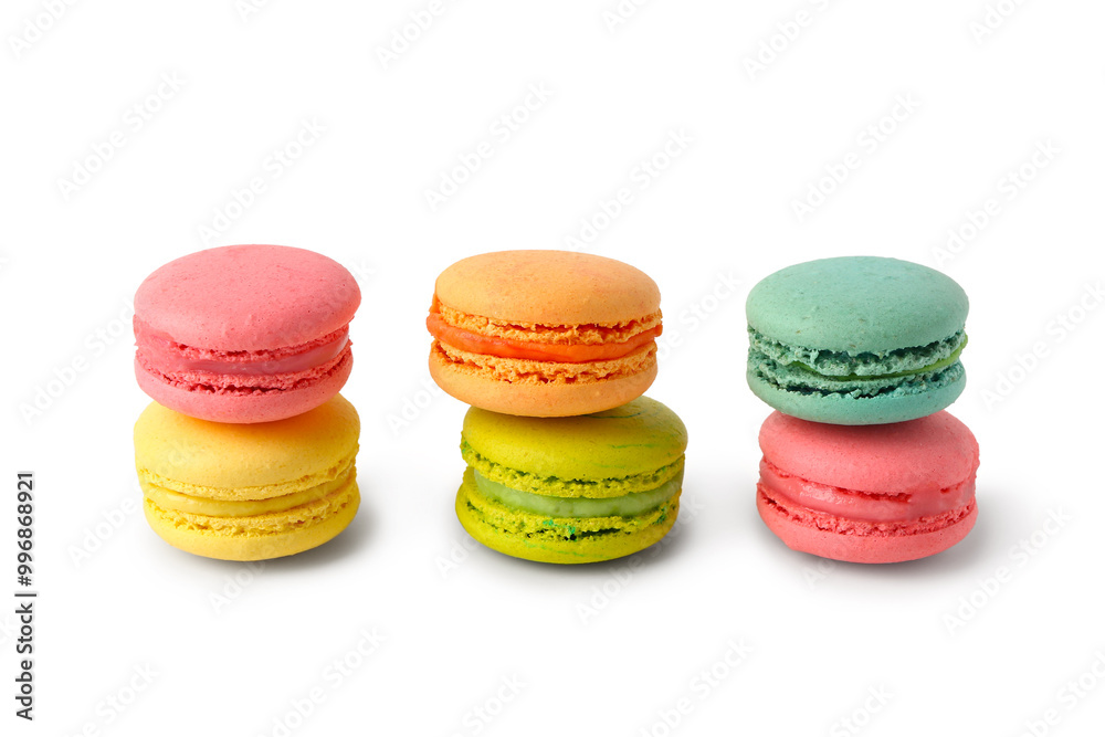 Fototapeta premium Different tasty sweet macaroons on white background