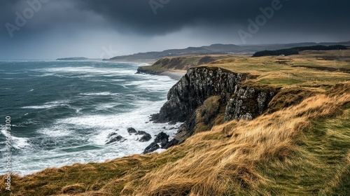 A cold, windy day on a coastal cliff with a clean horizon for copy.