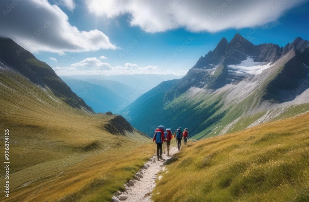 Banner. A group of people with backpacks are walking along a mountain ridge overlooking a stunning mountain landscape. Banner. A group of people with backpacks are walking along a mountain ridge overlooking a stunning mountain landscape.
