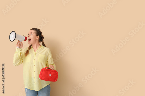 Young woman with first aid ...