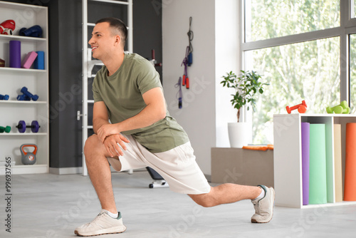 Sporty young man training i...