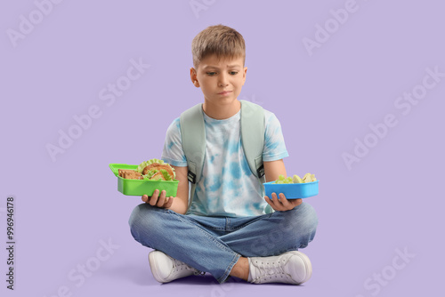 Thoughtful little boy with ...