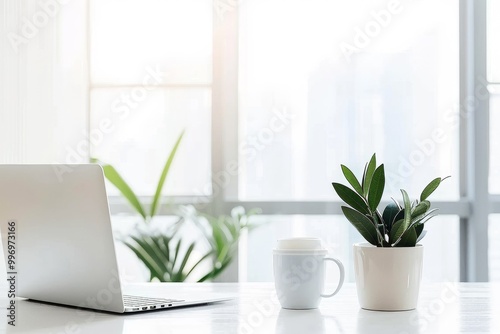 Minimalist home office setup with a laptop and green plants on a white desk, creating a clean and bright workspace that promotes productivity and creativity., Generative AI