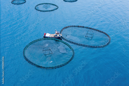 Canvas Print Service feeding boat on offshore aquafarming fish farm in sea for cultivation fish
