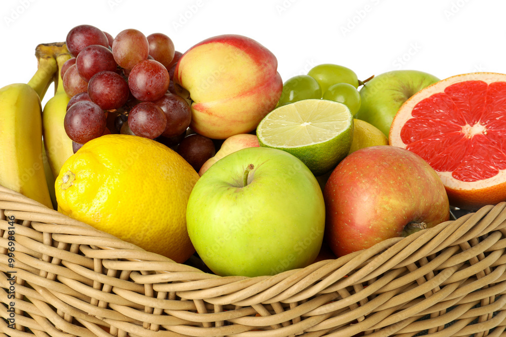Many different fresh fruits in wicker basket isolated on white Many different fresh fruits in wicker basket isolated on white