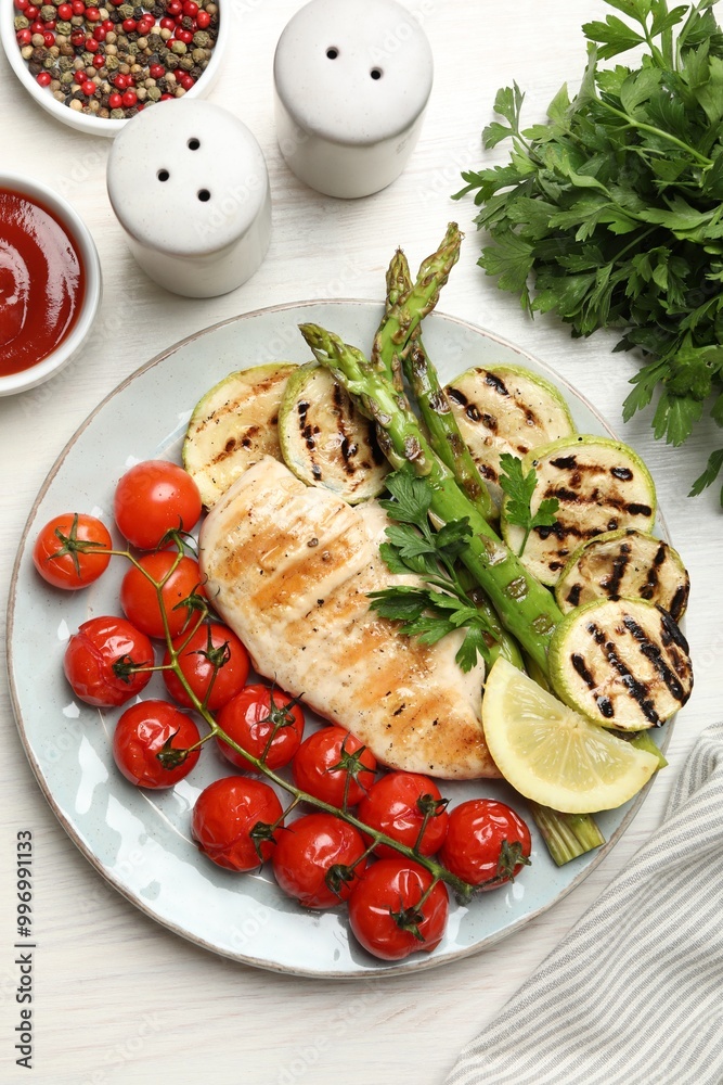 Delicious grilled vegetables and chicken breast served on white wooden table, flat lay Delicious grilled vegetables and chicken breast served on white wooden table, flat lay