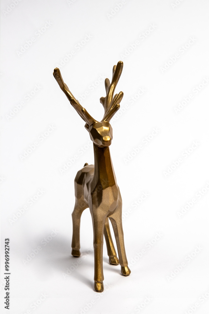 Gold christmas reindeer on a white background. Creative Christmas or New Year concept. Gold christmas reindeer on a white background. Creative Christmas or New Year concept.