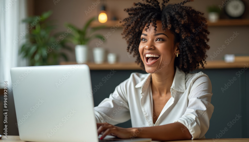Happy woman smiling joyfully while working on laptop Happy woman smiling joyfully while working on laptop
