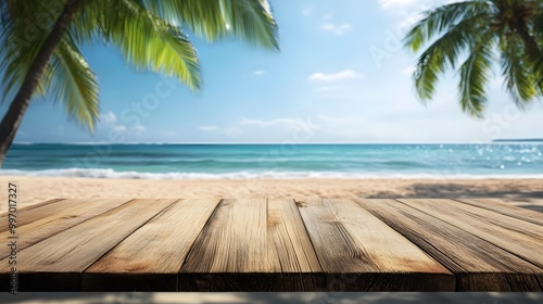 Empty wooden table top with blurred tropical beach background for product display montage, with copy space