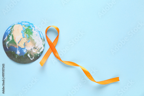 Orange ribbon and paper pla...