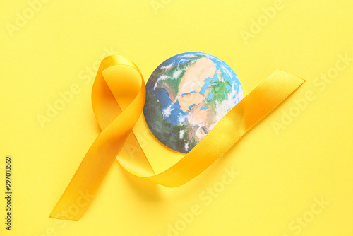 Yellow ribbon and paper pla...