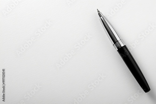 An isolated black pen blank mockup with grey and white backdrop and high angle view