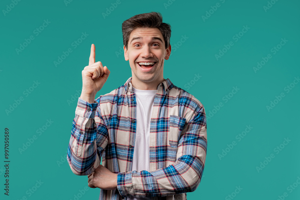 Brainy man having idea eureka moment, pointing finger up on blue. Solution. Brainy man having idea eureka moment, pointing finger up on blue. Solution.
