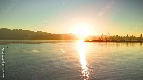 sunrise over the bay in Vancouver with water reflection