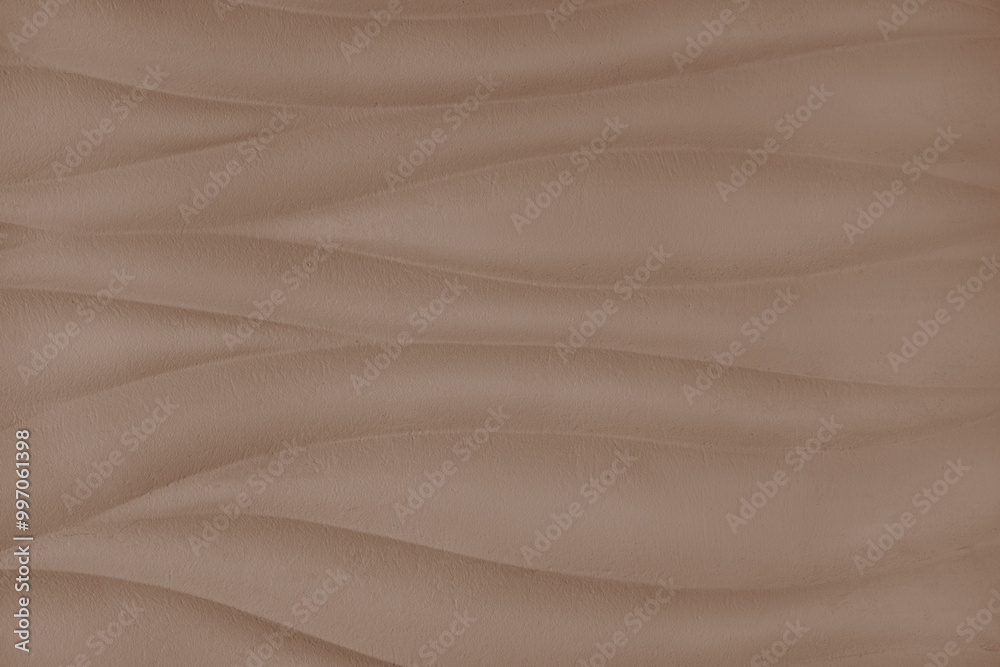 Plaster wall with volumetric relief surface wavy form pattern, brown gypsum texture panel. Plaster wall with volumetric relief surface wavy form pattern, brown gypsum texture panel.