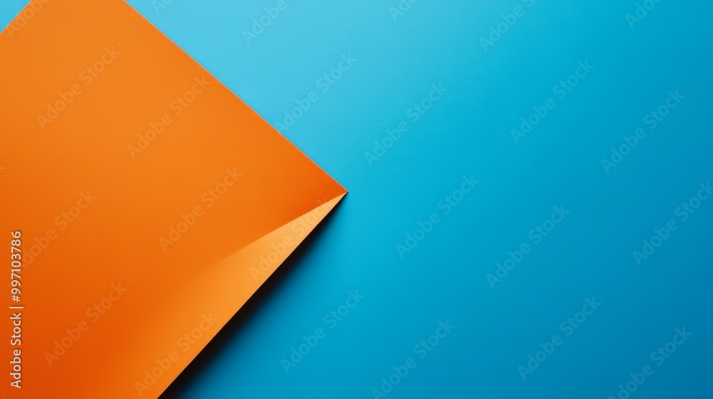 A vibrant orange sheet of paper sits at an angle against a blue backdrop, featuring a handwritten message advocating for equal pay. This striking composition highlights social awareness A vibrant orange sheet of paper sits at an angle against a blue backdrop, featuring a handwritten message advocating for equal pay. This striking composition highlights social awareness