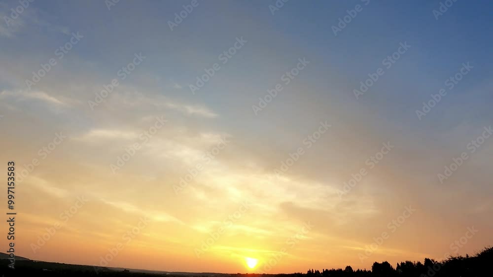 Sunset timelapse over the farmland in Alberta’s Prairies, Canada. Colorful sunrise sky with slow-moving clouds. Canadian Prairies. Alberta Canada. golden sun at the horizon ready to rise up the sky Sunset timelapse over the farmland in Alberta’s Prairies, Canada. Colorful sunrise sky with slow-moving clouds. Canadian Prairies. Alberta Canada. golden sun at the horizon ready to rise up the sky