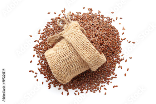 Close-up of organic Flaxseeds (Linum usitatissimum) in a jute bag on a heap of Flaxseeds, isolated on a white background.