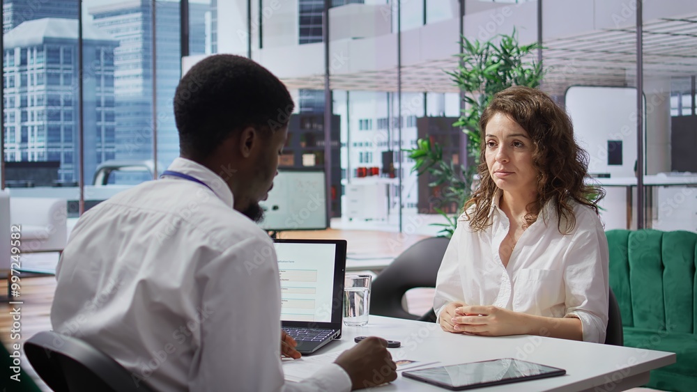 HR expert discussing with a skilled job candidate during interview, looking for personnel to fill in job opening in a multinational company. Businesswoman applying for job offer. Camera B. HR expert discussing with a skilled job candidate during interview, looking for personnel to fill in job opening in a multinational company. Businesswoman applying for job offer. Camera B.