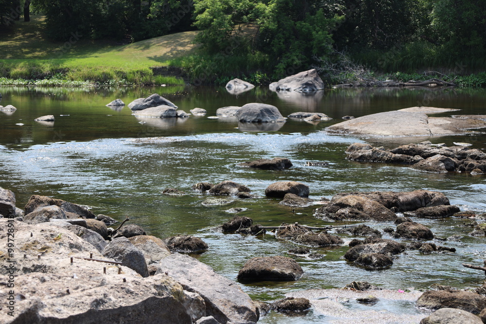 shallow river pools upstream from rocky section shallow river pools upstream from rocky section