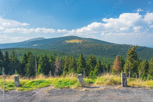 Fototapeta Naklejka Na Ścianę i Meble -  Karkonosze Mountains, Western Sudetes, mountain landscape on the hiking trail with views of the peaks, dense forest on the mountain slopes.