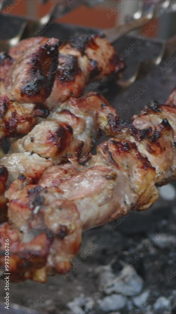 Close-Up Of Succulent Grilled Meat Skewers Sizzling Over An Open Barbecue Grill. The Image Captures The Essence Of Outdoor Cooking, Aromatic Spices, And Appetizing Food Preparation. Vertical. Close-Up Of Succulent Grilled Meat Skewers Sizzling Over An Open Barbecue Grill. The Image Captures The Essence Of Outdoor Cooking, Aromatic Spices, And Appetizing Food Preparation. Vertical.