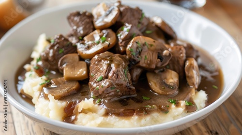 Tender beef tips with mushrooms and onions over mashed potatoes and gravy