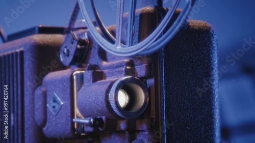 A vintage 8mm projector spins an old movie reel in a dark, cozy room, filling the space with the charm of retro cinema.