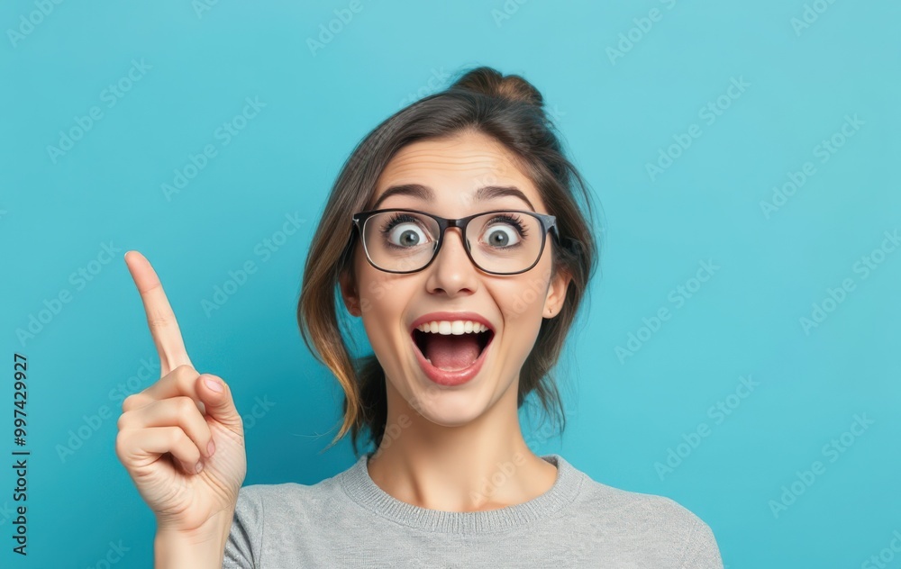 Woman Expressing Joy and Pointing Upward Woman Expressing Joy and Pointing Upward