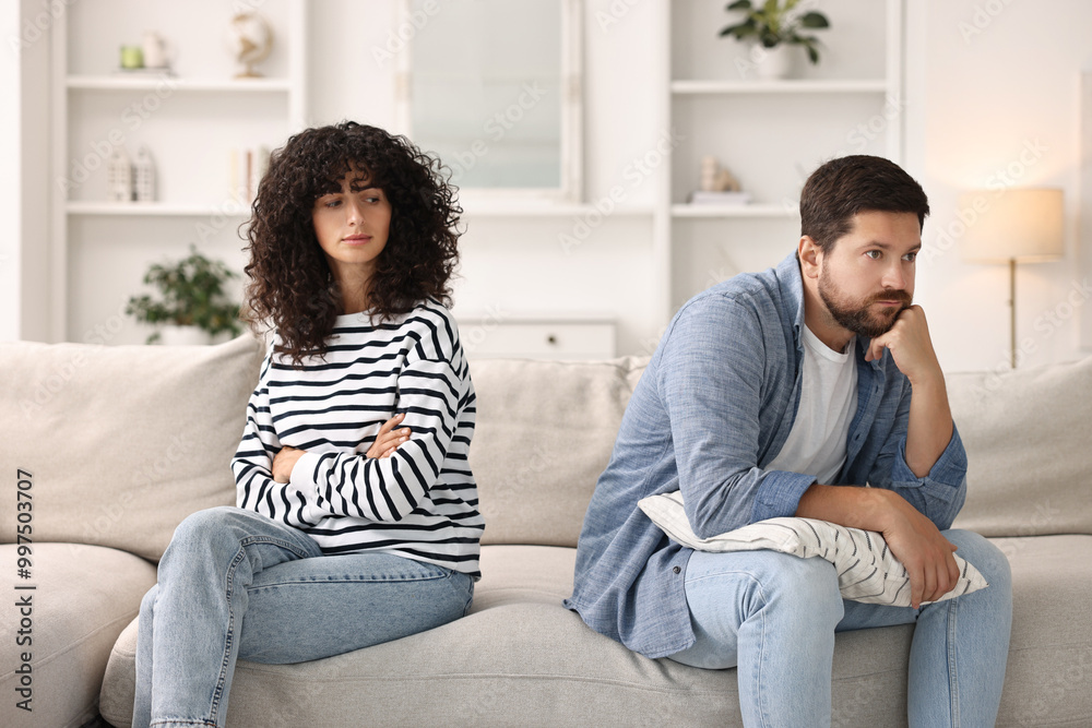Couple having quarrel on sofa at home. Relationship problems Couple having quarrel on sofa at home. Relationship problems