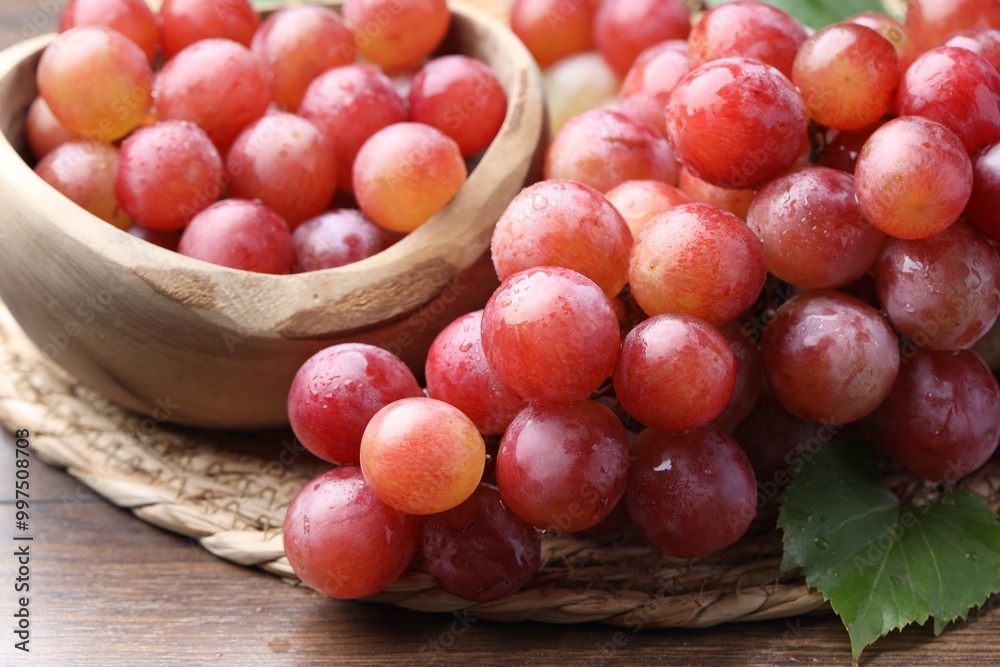 Fresh ripe grapes on wooden table, closeup Fresh ripe grapes on wooden table, closeup