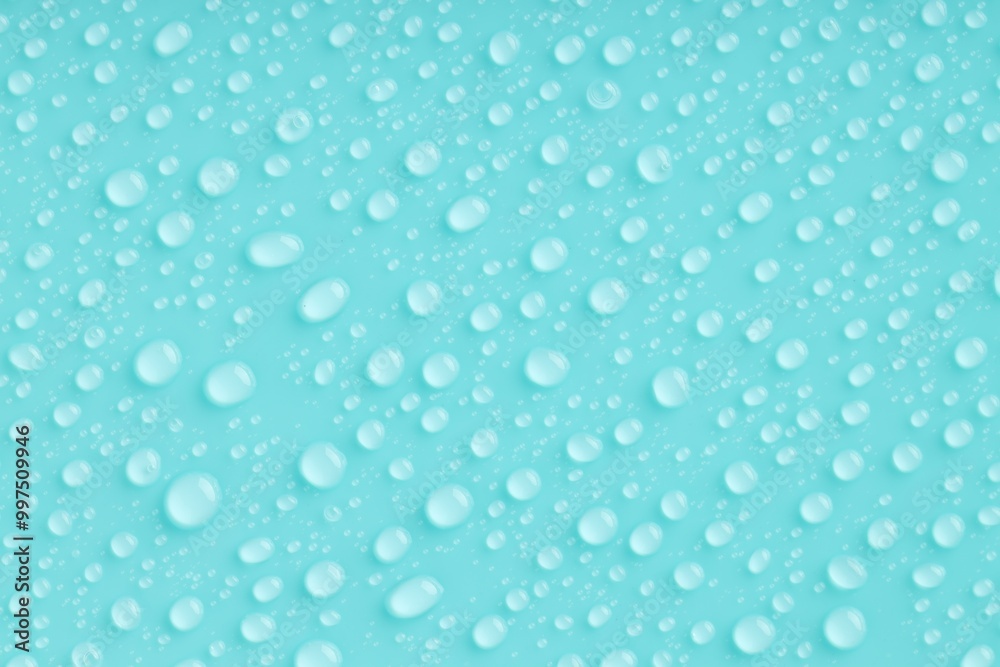 Water drops on turquoise background, top view Water drops on turquoise background, top view