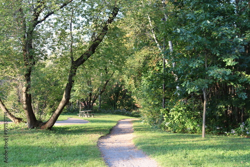 Path in the park in Wendake. Summer background with trees. Green and trees. Summer activities and trail.