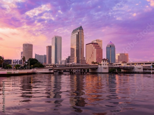 Platt Street Bridge crossing the Hillsborough River and buildings in downtown Tampa during a dramatic sunset, Florida, United States.