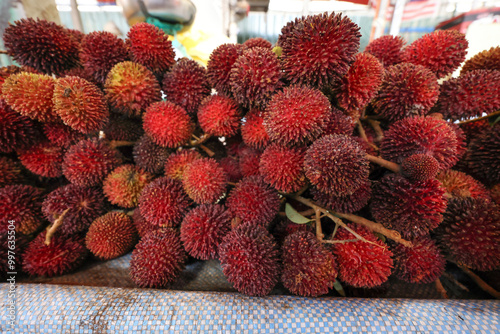 Early morning products and produce at Malaysian wet market selling fish beef chicken fruit vegetable grocery photo