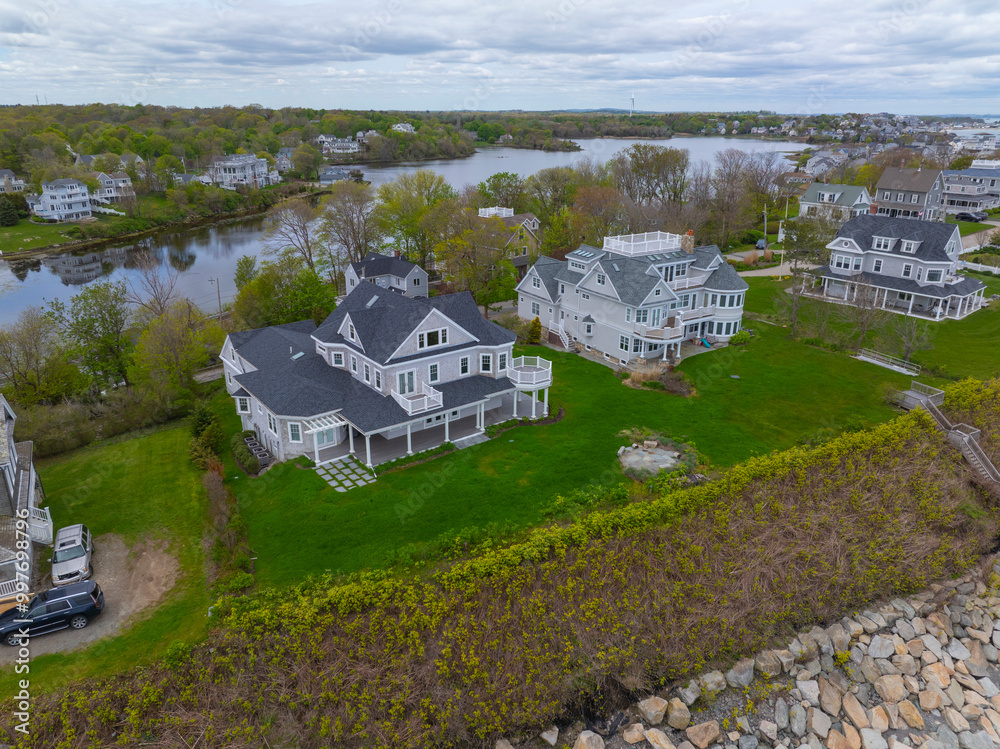 Fototapeta premium Historic coastal mansion aerial view in a cloudy at the coast of Hull near Cohasset, Massachusetts MA, USA. 