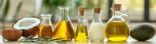 An array of keto-friendly oils like coconut oil, olive oil, and avocado oil, arranged in a stylish kitchen, keto fats, low-carb meal prep essentials