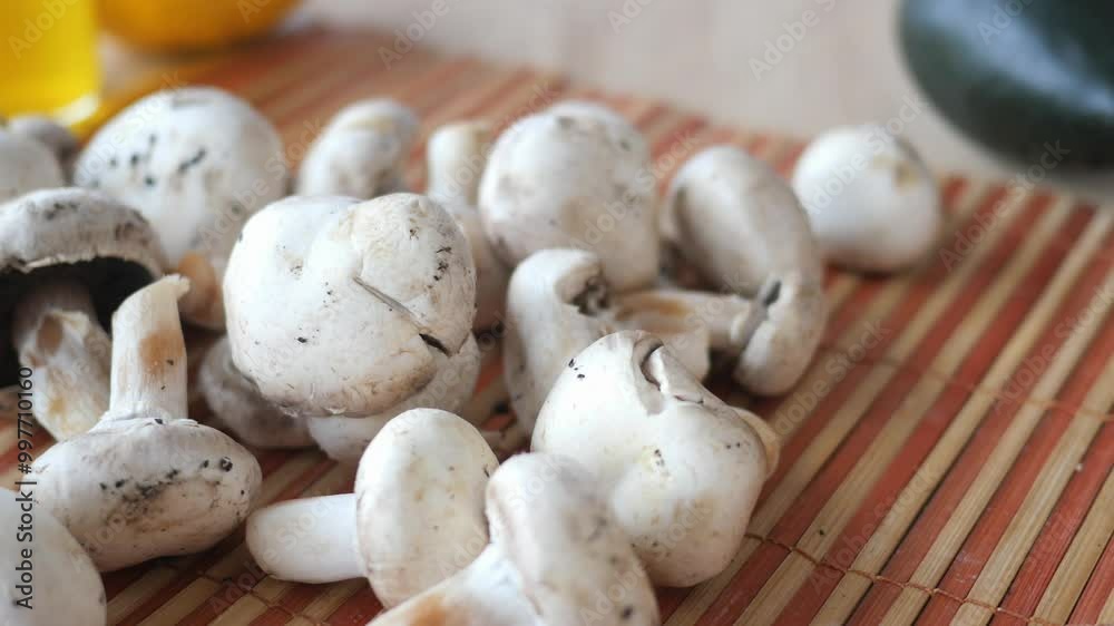 A selection of Fresh Mushrooms beautifully arranged on a Wooden Cutting Board for culinary use A selection of Fresh Mushrooms beautifully arranged on a Wooden Cutting Board for culinary use