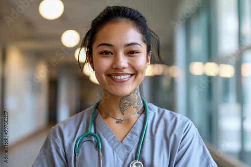 Smiling Nurse with Stethoscope in Hospital Hallway
