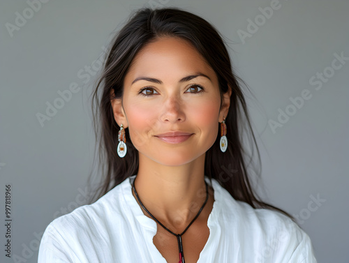 Smiling Woman Portrait with Ethnic Jewelry and Natural Beauty in Casual Elegance