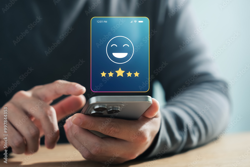 © Thapana_Studio - Online customer satisfaction survey concept, consumers give five-star ratings and reviews on product quality and service, increasing business credibility and reputation ranking.