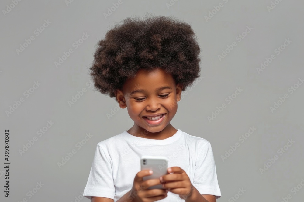 Kid Texting. Young Boy Learning Foreign Language on Smartphone with Happy Expression Kid Texting. Young Boy Learning Foreign Language on Smartphone with Happy Expression