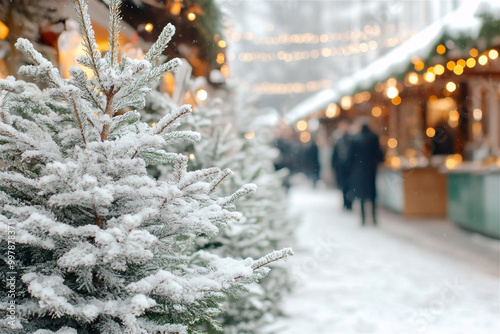 Snowy pine trees framing christmas market stalls with people shopping during the holidays