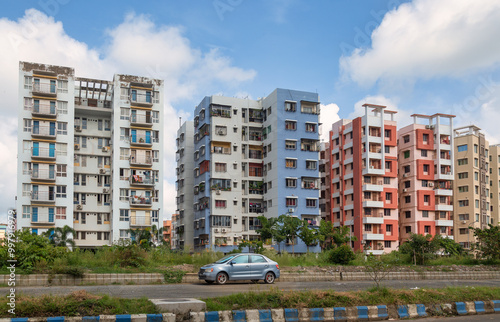 Fototapeta Naklejka Na Ścianę i Meble -  Residential apartment buildings with view of city road at New Town, Rajarhat area at Kolkata, India. 
